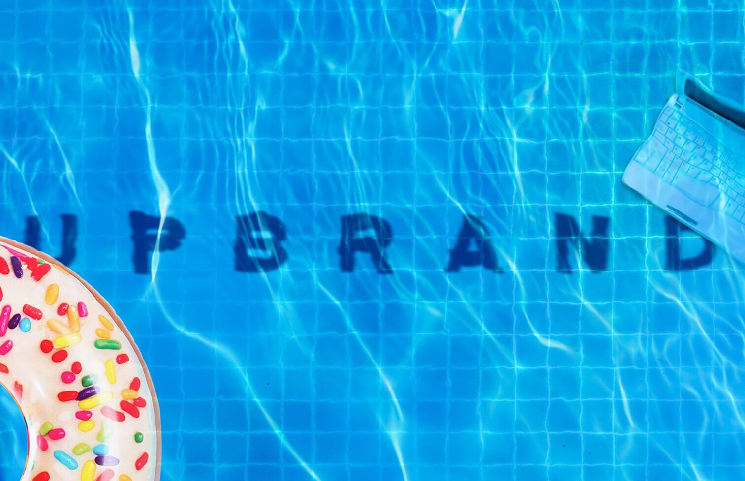  an image of a pool with a float in it and the word upbrand under the water